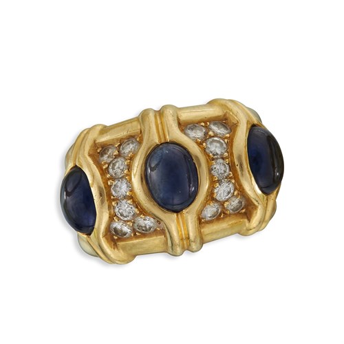 Lot 70 - An eighteen karat gold and sapphire bangle and ring