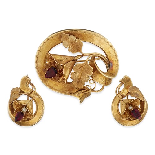Lot 6 - A collection of three eighteen karat gold, garnet, and seed pearl brooches