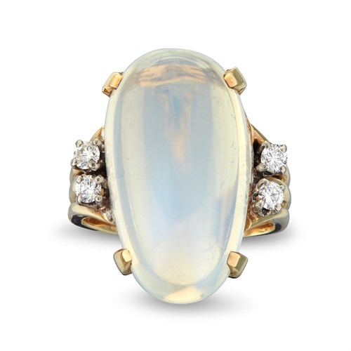 Lot 4 - A moonstone, diamond and fourteen karat gold and palladium ring