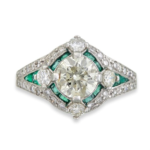 Lot 125 - A diamond, emerald, and platinum ring