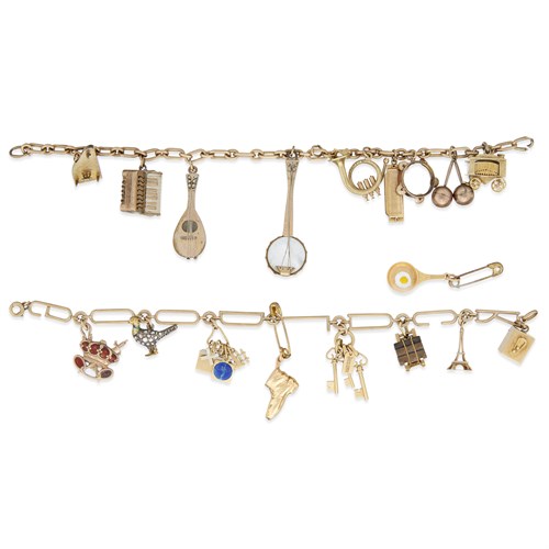 Lot 87 - A collection of two gold, gem-set, and metal charms