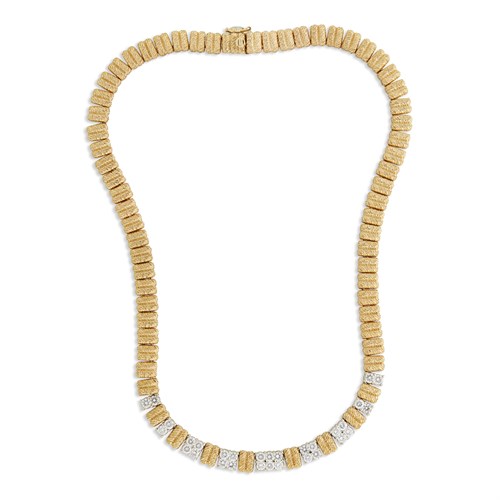 Lot 26 - A diamond and fourteen karat two-tone gold necklace