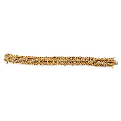 Lot 108 - An eighteen karat gold and diamond bracelet