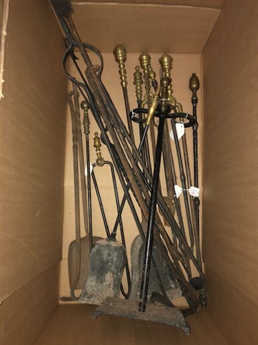 Lot 54 - A large assembled group of iron and brass fireplace tools