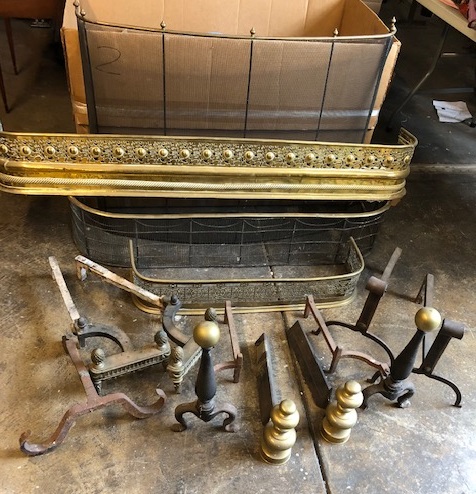 Lot 53 - An assembled group of brass and iron fireplace fenders and andirons