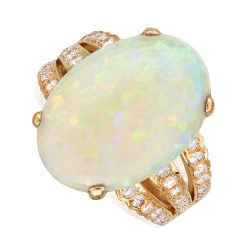 Lot 104 - An opal, diamond, and eighteen karat gold ring