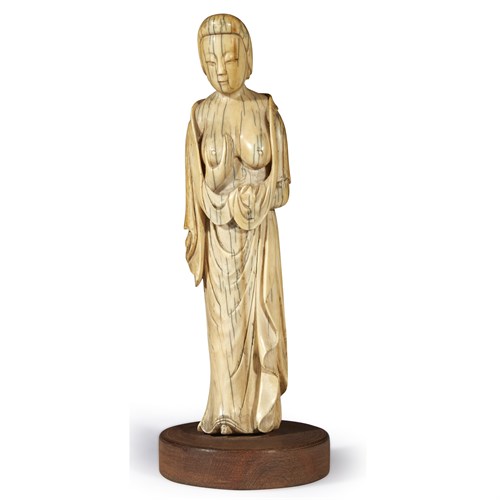 Lot 79 - *A Chinese ivory carving of a meiren