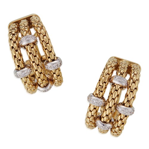 Lot 109 - A pair of diamond and eighteen karat two-tone gold earrings