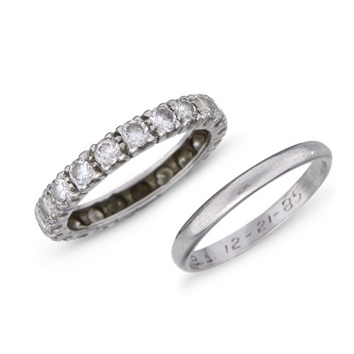Lot 43 - A diamond and platinum eternity ring and platinum band