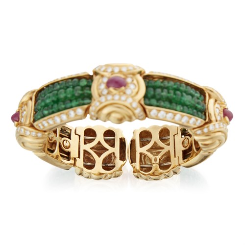Lot 164 - An eighteen karat gold, emerald, ruby, and diamond bracelet