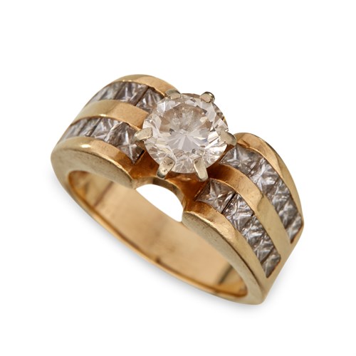 Lot 58 - A fourteen karat gold and diamond ring