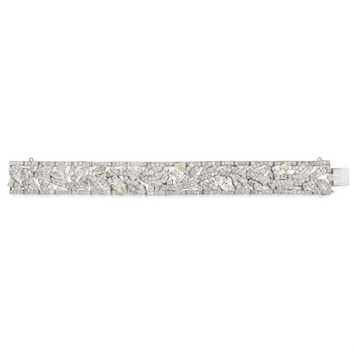 Lot 191 - A diamond and platinum strap bracelet, Cartier