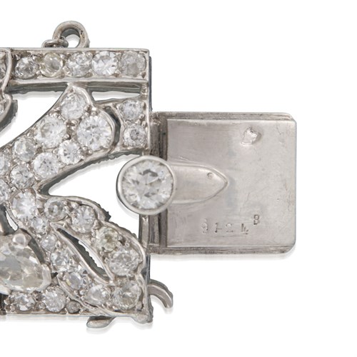 Lot 191 - A diamond and platinum strap bracelet, Cartier