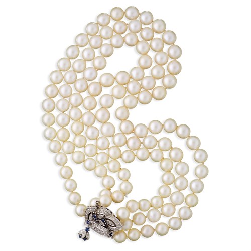 Lot 52 - A cultured pearl, diamond, sapphire, and fourteen karat white gold necklace