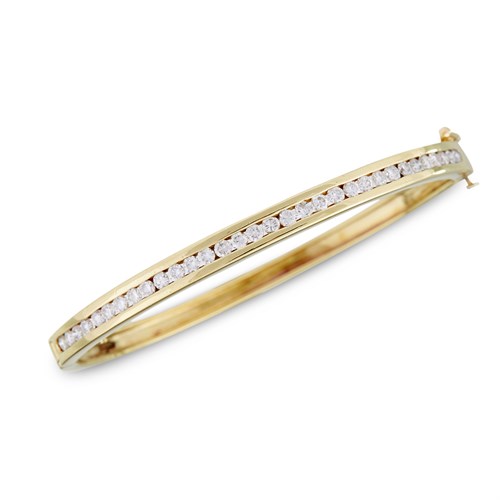 Lot 24 - A fourteen karat gold and diamond bangle bracelet
