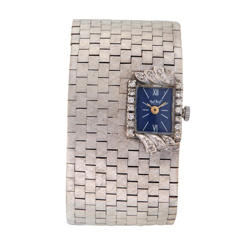 Lot 122 - A fourteen karat white gold strap bracelet with later added watch