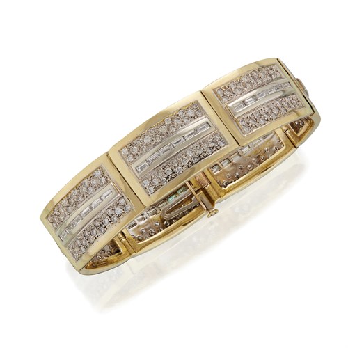 Lot 38 - A diamond and two-tone eighteen karat gold bracelet