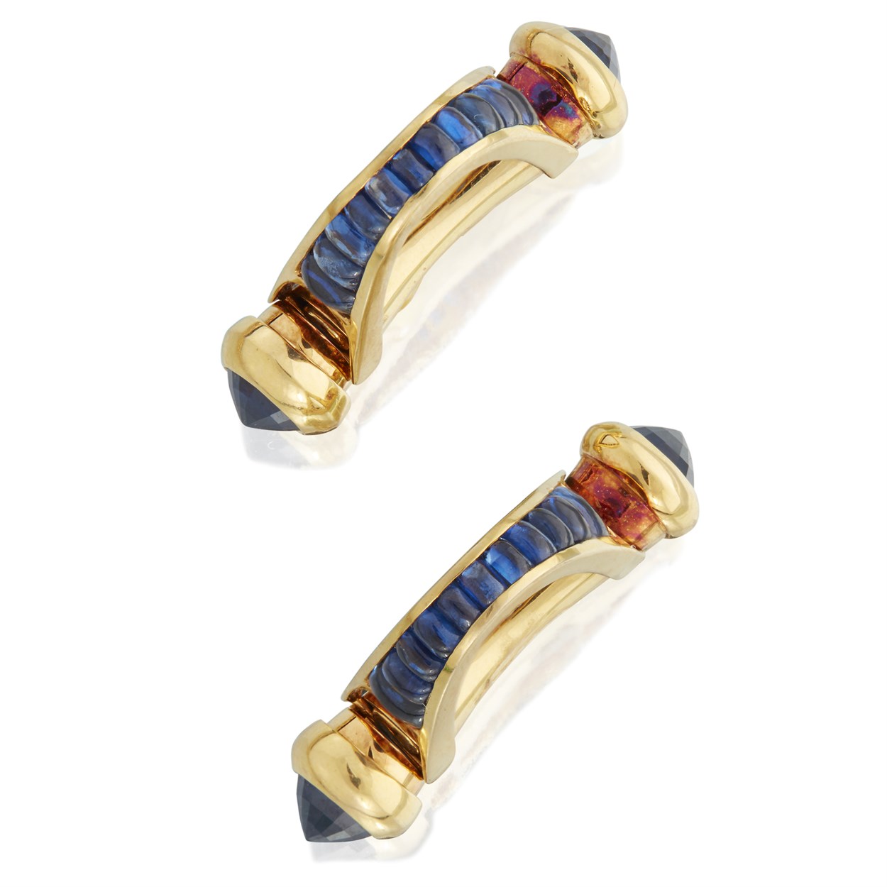 Lot 19 - A pair of eighteen karat gold and sapphire cufflinks