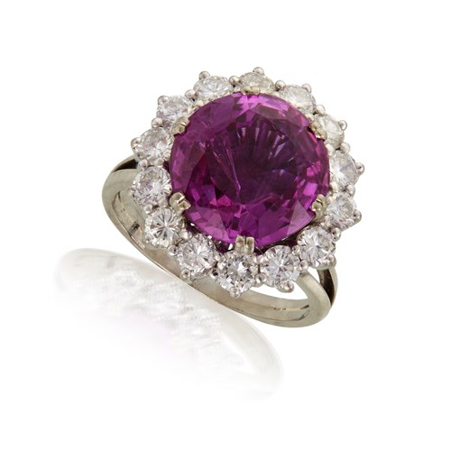 Lot 79 - A platinum, pink sapphire, and diamond ring