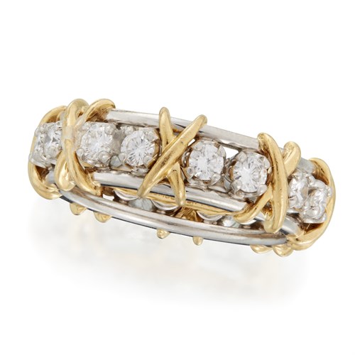 Lot 189 - A diamond, eighteen karat gold, and platinum band, Tiffany & Co.