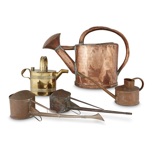 Lot 73 - A group of five assorted copper and brass watering cans