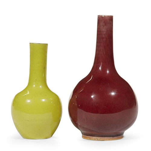 Lot 41 - A Chinese yellow-enameled porcelain bottle vase and a copper-red example