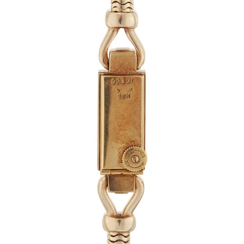 Lot 119 - A Retro eighteen karat gold bracelet wristwatch, Cartier