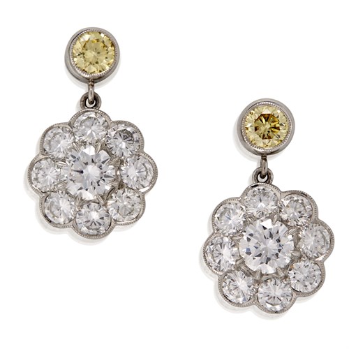 Lot 150 - A pair of yellow diamond, diamond, and platinum ear pendants