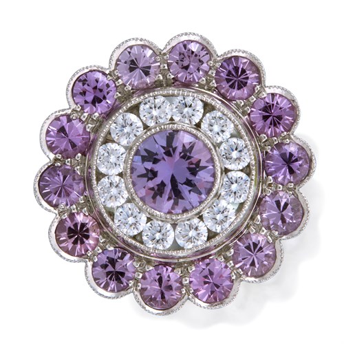 Lot 170 - A purple sapphire, diamond, and platinum ring