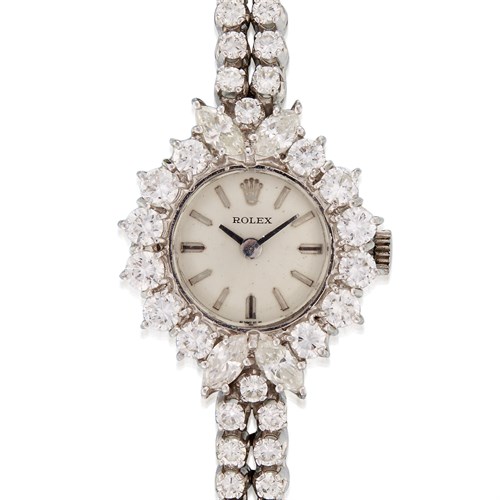 Lot 117 - A diamond and eighteen karat white gold bracelet wristwatch with Rolex movement and dial