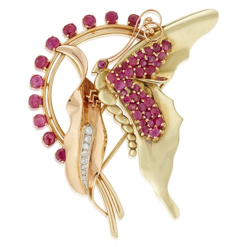 Lot 114 - A fourteen karat two-tone gold and ruby brooch