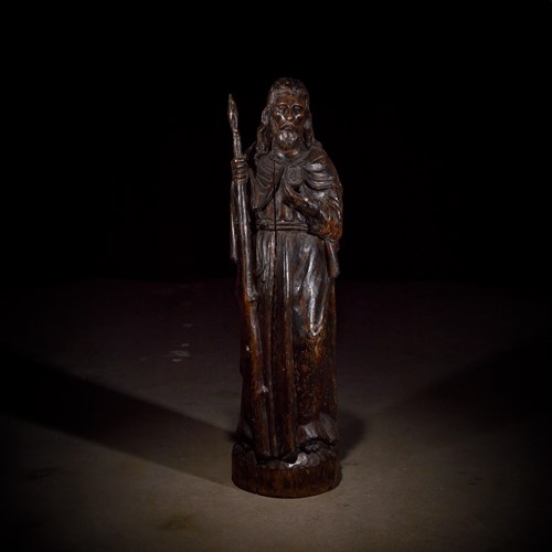 Lot 9 - A French late Gothic carved walnut figure of Saint Thomas the Apostle