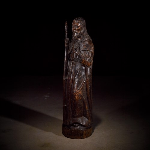 Lot 9 - A French late Gothic carved walnut figure of Saint Thomas the Apostle