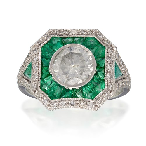 Lot 72 - A diamond, emerald, and platinum ring