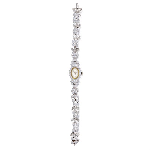 Lot 169 - A lady's platinum and diamond bracelet wrist watch, with Rolex movement and dial
