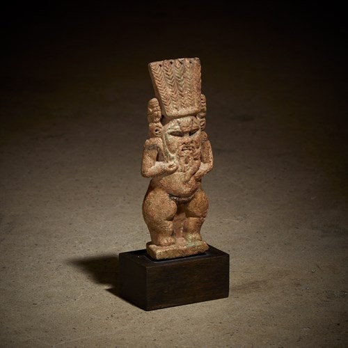 Lot 2 - An Egyptian faience Bes figure