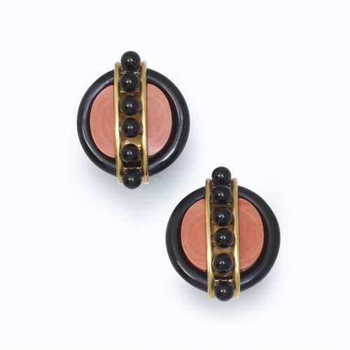 Lot 17 - A pair of onyx, coral, and eighteen karat gold ear clips, Aldo Cipullo