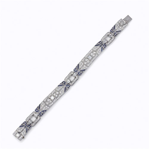 Lot 70 - A diamond, sapphire, and platinum strap bracelet