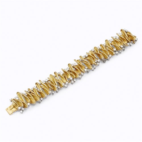 Lot 21 - An eighteen karat gold and diamond bracelet