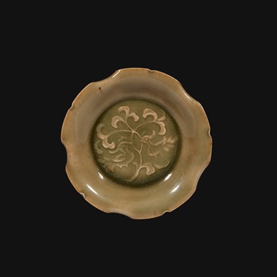Lot 26 - A small Yaozhou molded and carved lobed celadon dish