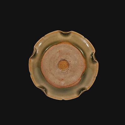 Lot 26 - A small Yaozhou molded and carved lobed celadon dish