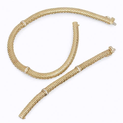 Lot 39 - An eighteen karat gold and diamond necklace with matching bracelet