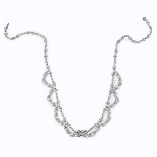 Lot 62 - A diamond, platinum, and eighteen karat white gold necklace