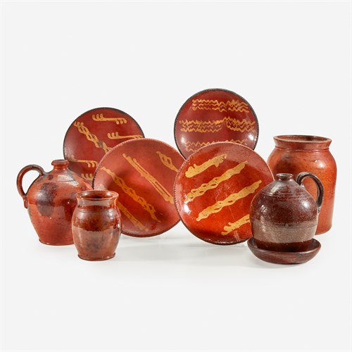 Lot 54 - A collection of nine glazed and redware tablewares