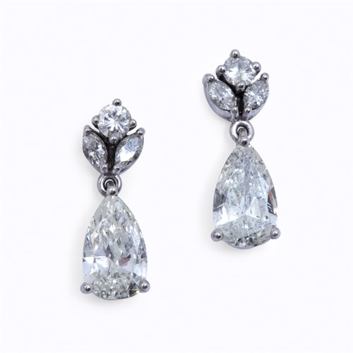 Lot 89 - A pair of diamond and platinum drop earrings