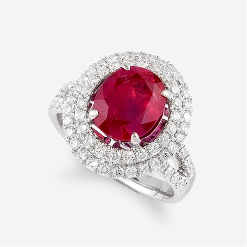 Lot 75 - A ruby, diamond, and eighteen karat white gold ring
