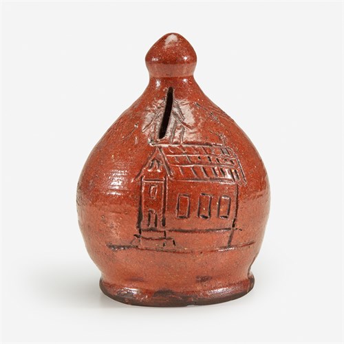 Lot 51 - A glazed redware bank incised with a church