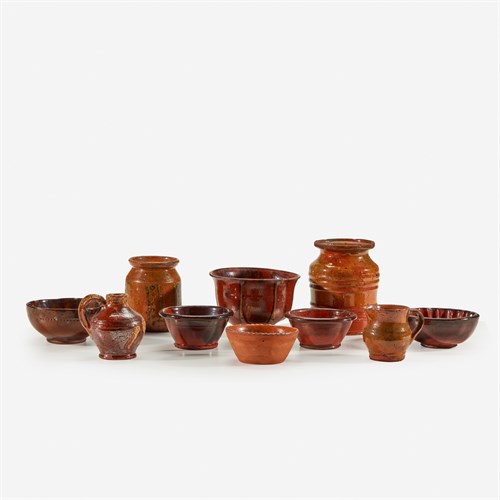 Lot 57 - A group of assorted small glazed redware items