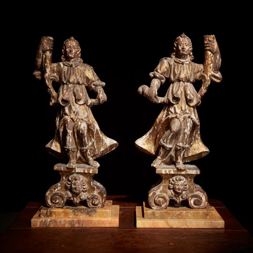 Lot 13 - A pair of Italian Baroque gilt and polychrome decorated figural torchères