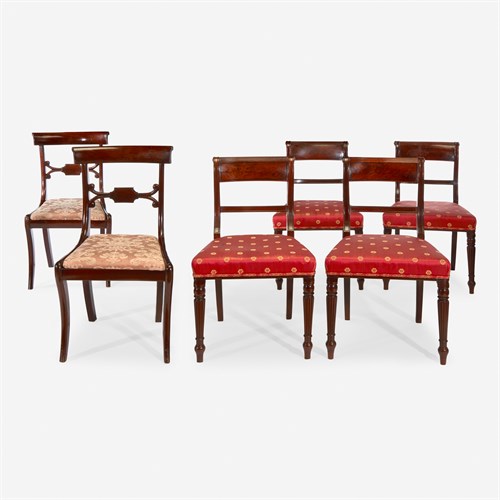 Lot 79 - A set of four Classical carved mahogany side chairs